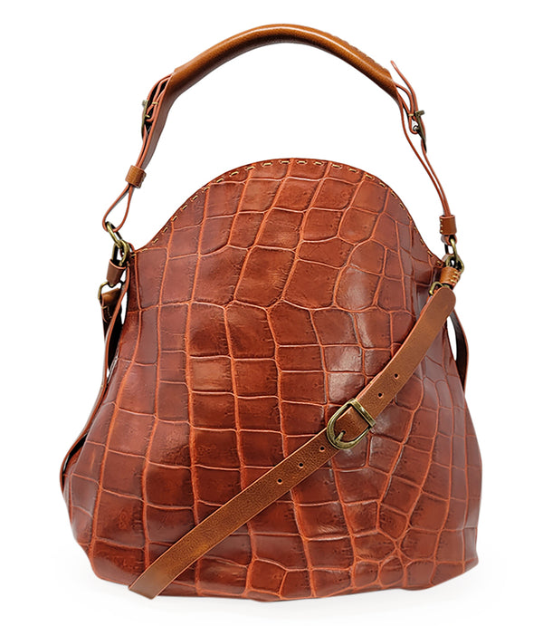 "Large hobo-style shoulder bag crafted from premium leather with an all-over crocodile-embossed texture. Features a wide, adjustable leather shoulder strap with metal hardware and an open top for easy access. Softly structured body designed for a relaxed