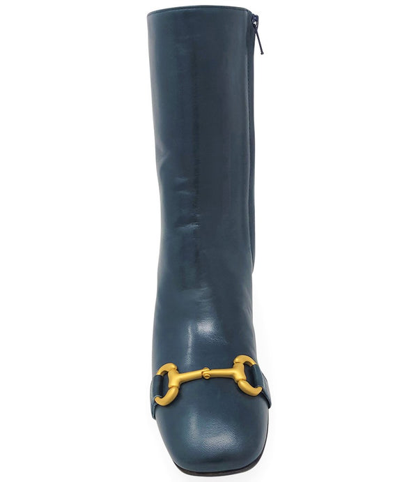 A mid-calf leather boot with a block heel and square toe, featuring a decorative metal accent across the toe. Designed by Madison in Beverly Hills and handcrafted in Italy.