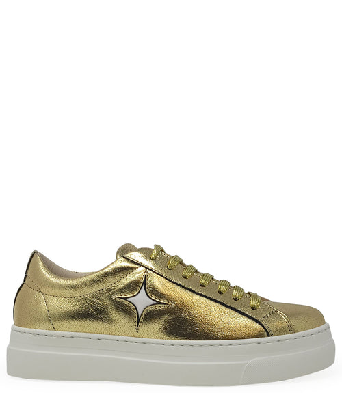 Low-top luxury sneaker featuring a smooth leather upper with a metallic finish, a signature star-shaped side detail, padded collar, lace-up front, and a thick rubber platform sole. Designed with a leather-lined interior and cushioned footbed for enhanced
