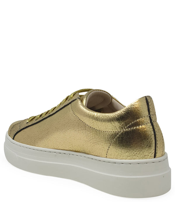 Low-top luxury sneaker featuring a smooth leather upper with a metallic finish, a signature star-shaped side detail, padded collar, lace-up front, and a thick rubber platform sole. Designed with a leather-lined interior and cushioned footbed for enhanced