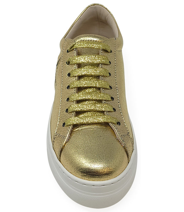 Low-top luxury sneaker featuring a smooth leather upper with a metallic finish, a signature star-shaped side detail, padded collar, lace-up front, and a thick rubber platform sole. Designed with a leather-lined interior and cushioned footbed for enhanced