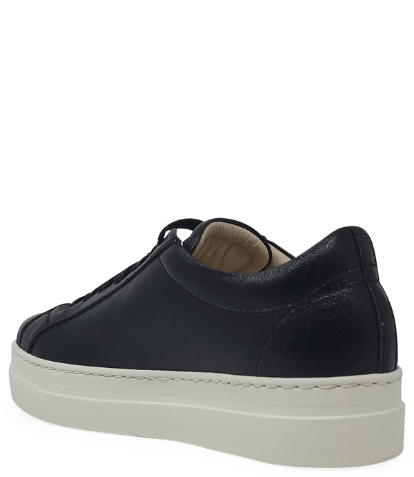 Low-top luxury sneaker featuring a smooth leather upper with a metallic finish, a signature star-shaped side detail, padded collar, lace-up front, and a thick rubber platform sole. Designed with a leather-lined interior and cushioned footbed for enhanced