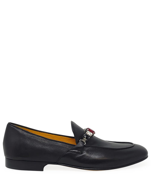 A leather loafer with a low stacked heel and rounded toe, featuring a decorative band adorned with faceted gemstone-style embellishments across the upper. Designed by Madison in Beverly Hills and handcrafted in Italy