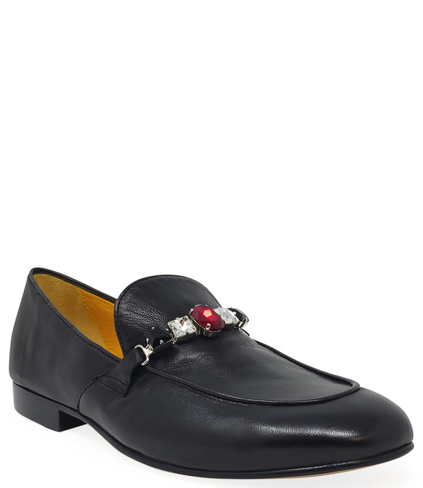 A leather loafer with a low stacked heel and rounded toe, featuring a decorative band adorned with faceted gemstone-style embellishments across the upper. Designed by Madison in Beverly Hills and handcrafted in Italy