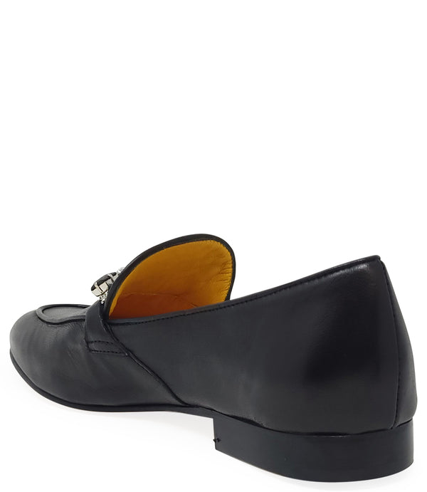 A leather loafer with a low stacked heel and rounded toe, featuring a decorative band adorned with faceted gemstone-style embellishments across the upper. Designed by Madison in Beverly Hills and handcrafted in Italy