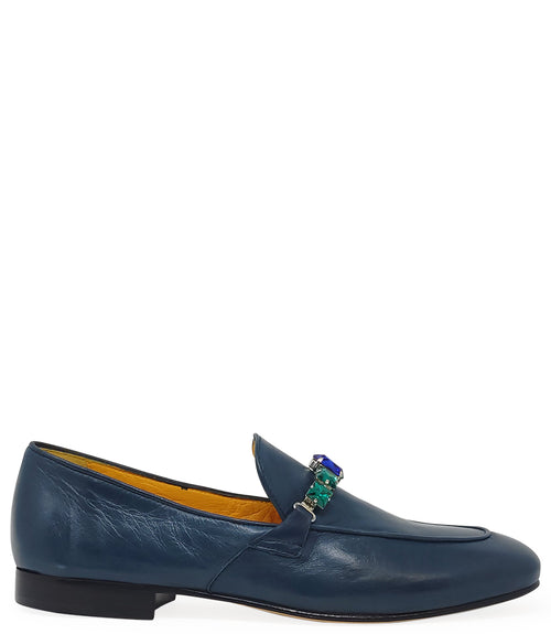 A leather loafer with a low stacked heel and rounded toe, featuring a decorative band adorned with faceted gemstone-style embellishments across the upper. Designed by Madison in Beverly Hills and handcrafted in Italy