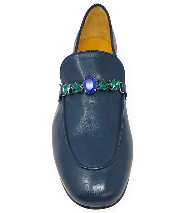 A leather loafer with a low stacked heel and rounded toe, featuring a decorative band adorned with faceted gemstone-style embellishments across the upper. Designed by Madison in Beverly Hills and handcrafted in Italy