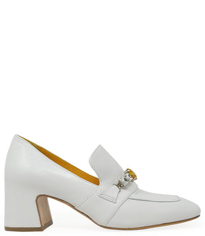 A leather heeled loafer with a block heel and square toe, featuring a decorative band with faceted gemstone-style embellishments across the upper. Designed by Madison in Beverly Hills and handcrafted in Italy.