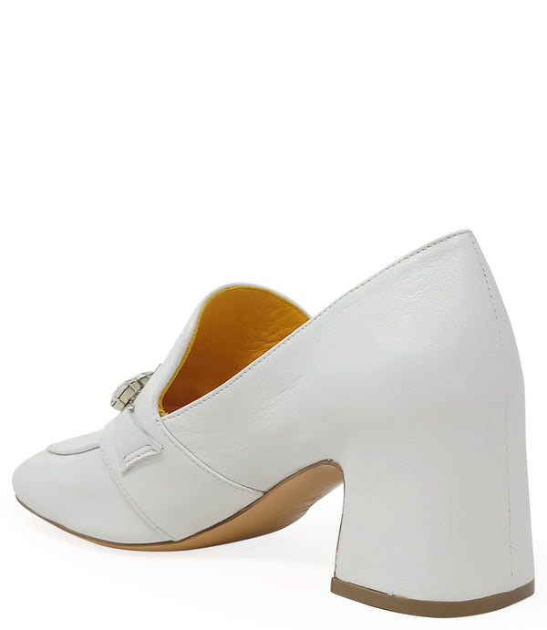 A leather heeled loafer with a block heel and square toe, featuring a decorative band with faceted gemstone-style embellishments across the upper. Designed by Madison in Beverly Hills and handcrafted in Italy.