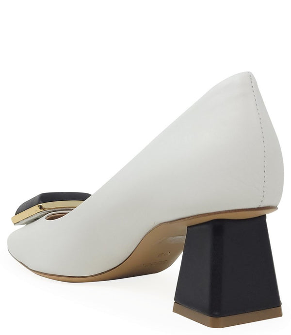 Elegant mid-heel pump handcrafted in Italy from 100% genuine leather, featuring a sculptural square embellishment on the toe and a block heel for all-day stability and style.
