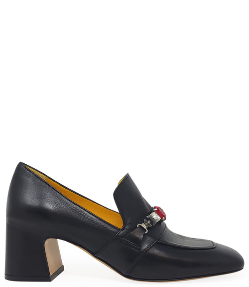A leather heeled loafer with a block heel and square toe, featuring a decorative band with faceted gemstone-style embellishments across the upper. Designed by Madison in Beverly Hills and handcrafted in Italy.