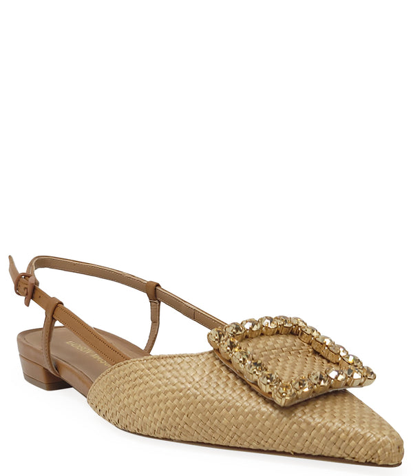 Pointed-toe slingback flat with low heel, adjustable ankle strap, and large decorative jewel embellishment on the toe. Features mixed material textures and an open heel design.