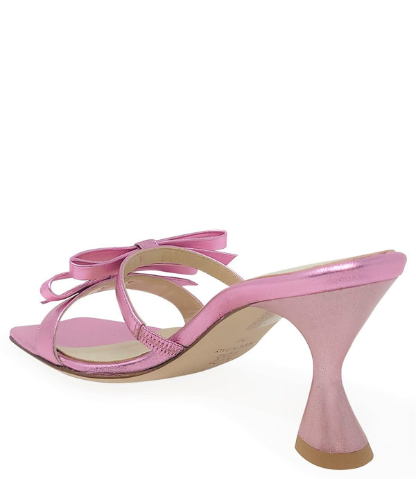 Women's open-toe sandal with a molded footbed, slip-on design, and decorative front strap featuring an embellished gemstone medallion. Crafted from smooth leather with a flat rubber sole. Designed in Italy by Madison Maison