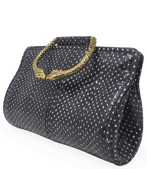 Structured mini handbag crafted from textured leather with a dotted pattern, featuring a sculptural metal snake-shaped top handle with dual serpent heads. Includes a detachable adjustable leather strap with metal clasps for versatile wear as a crossbody o