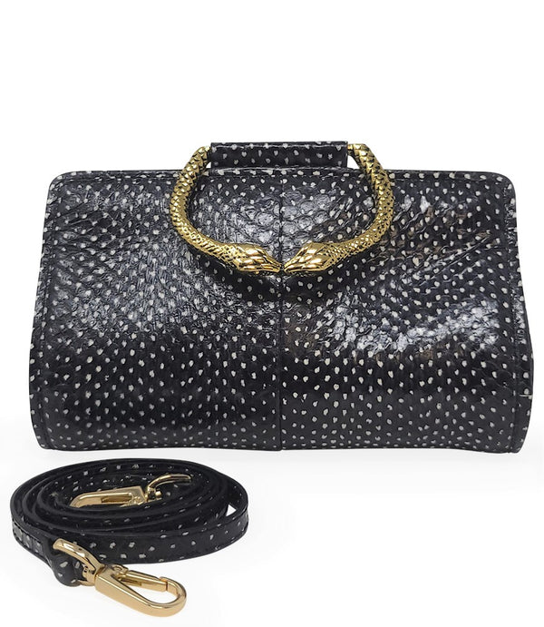 Structured mini handbag crafted from textured leather with a dotted pattern, featuring a sculptural metal snake-shaped top handle with dual serpent heads. Includes a detachable adjustable leather strap with metal clasps for versatile wear as a crossbody o