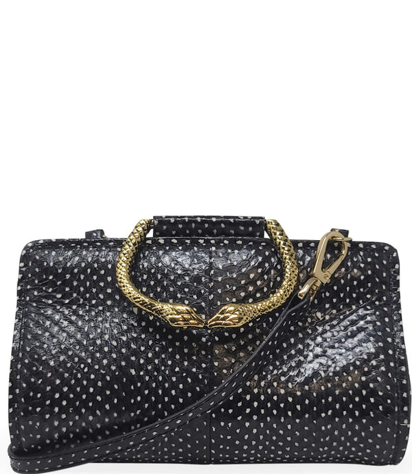 Structured mini handbag crafted from textured leather with a dotted pattern, featuring a sculptural metal snake-shaped top handle with dual serpent heads. Includes a detachable adjustable leather strap with metal clasps for versatile wear as a crossbody o