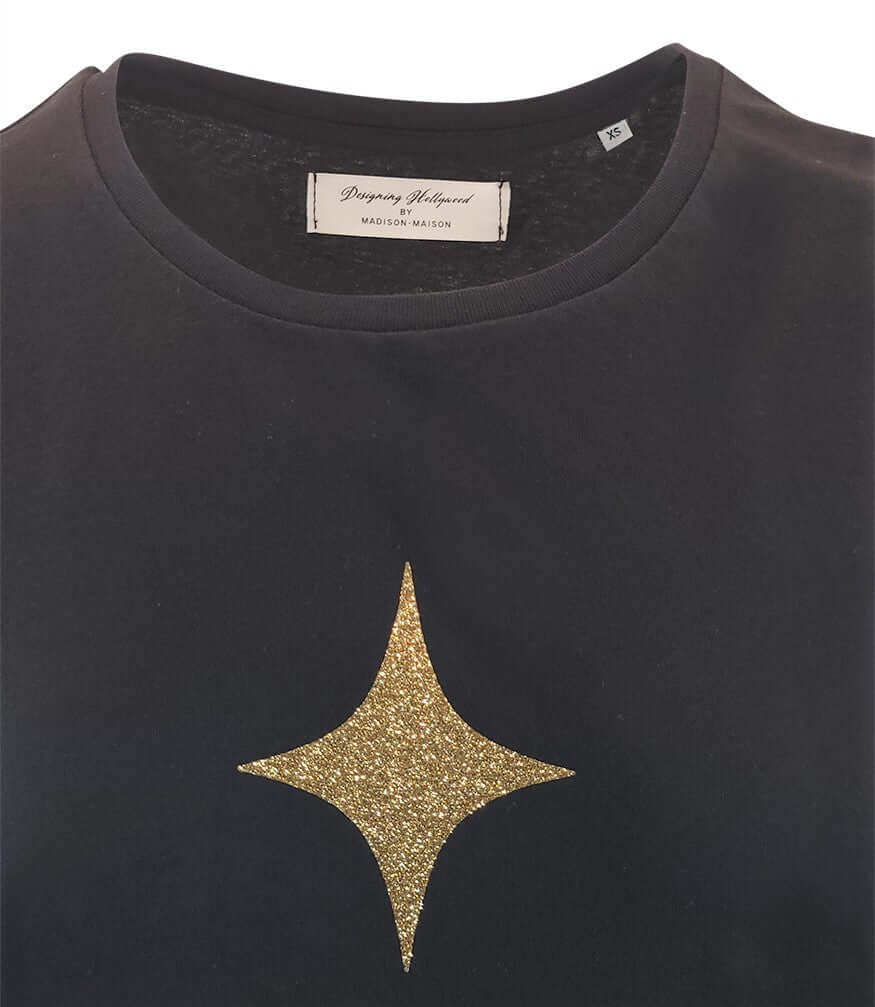 Black cotton T-shirt with small gold star graphic on front