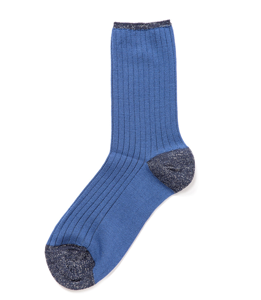A mid-calf knit sock featuring a mix of textured panels, ribbed leg section, and bold horizontal stripes around the arch and cuff.