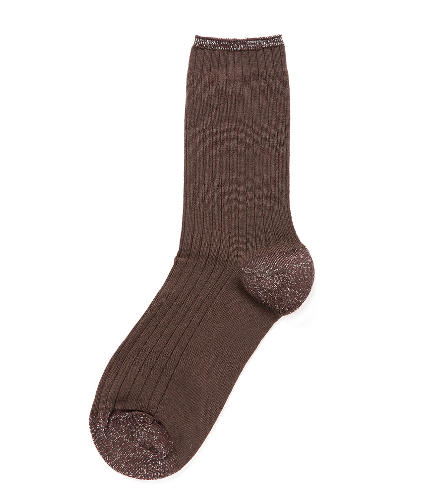 A mid-calf knit sock featuring a mix of textured panels, ribbed leg section, and bold horizontal stripes around the arch and cuff.