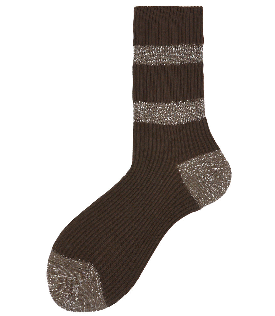 A mid-calf knit sock featuring a mix of textured panels, ribbed leg section, and bold horizontal stripes around the arch and cuff.