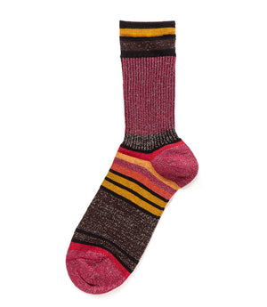 A mid-calf knit sock featuring a mix of textured panels, ribbed leg section, and bold horizontal stripes around the arch and cuff.