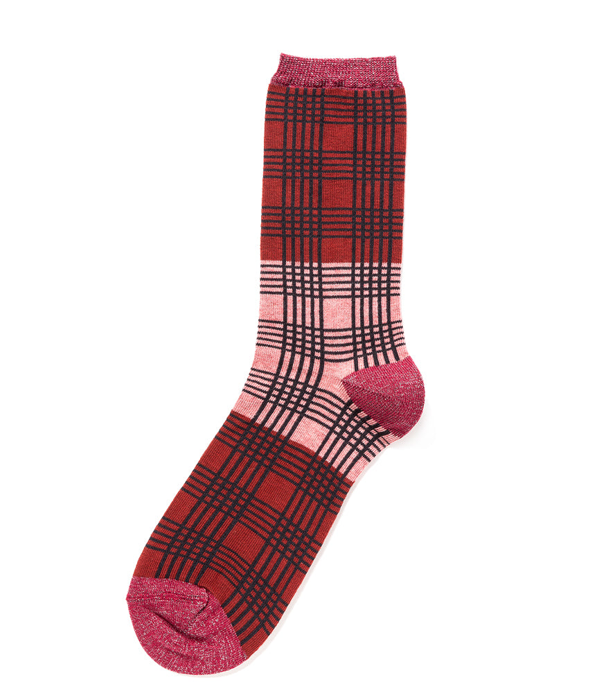 A mid-calf knit sock featuring a mix of textured panels, ribbed leg section, and bold horizontal stripes around the arch and cuff.