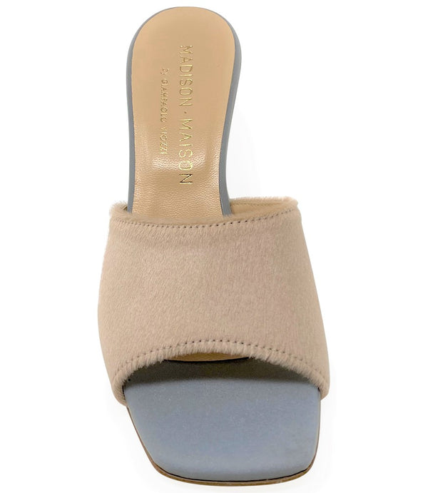 Handcrafted Italian mule with an open toe, flared heel, and a two-tone design. Features a wide vamp strap and cushioned insole for added comfort. Shown from multiple angles against a clean background