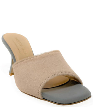 Handcrafted Italian mule with an open toe, flared heel, and a two-tone design. Features a wide vamp strap and cushioned insole for added comfort. Shown from multiple angles against a clean background