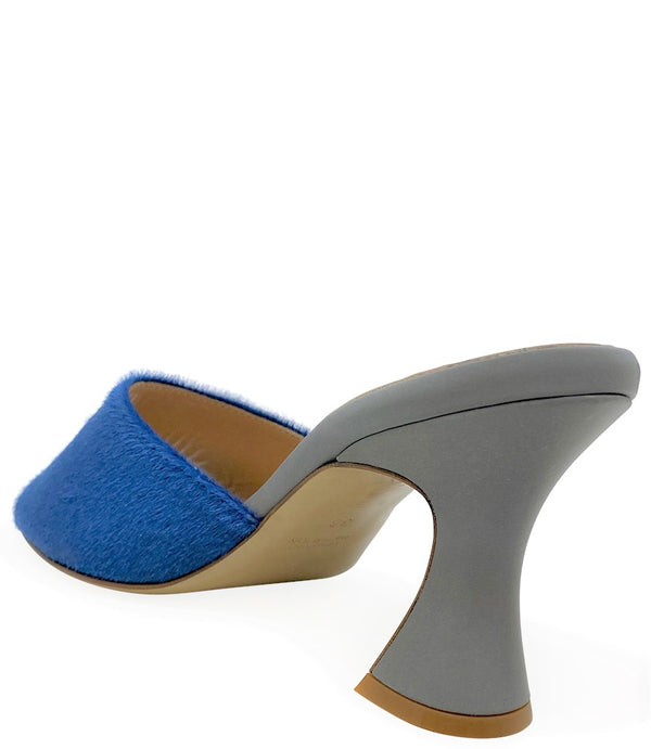Handcrafted Italian mule with an open toe, flared heel, and a two-tone design. Features a wide vamp strap and cushioned insole for added comfort. Shown from multiple angles against a clean background