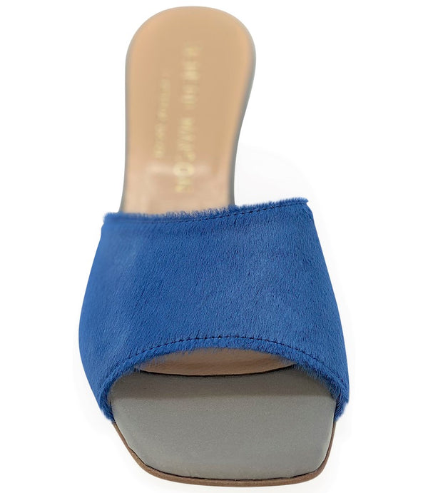 Handcrafted Italian mule with an open toe, flared heel, and a two-tone design. Features a wide vamp strap and cushioned insole for added comfort. Shown from multiple angles against a clean background