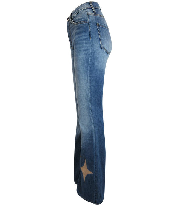 Flared-leg pants made in Italy with a mid-rise fit, featuring front and back pockets and star-shaped accents on the hip, lower leg, and back pocket. Displayed from multiple angles against a clean background