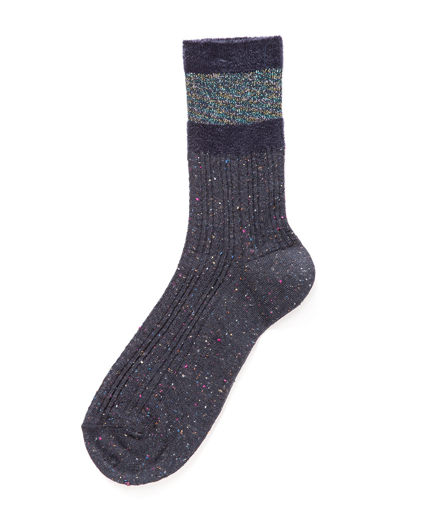 A mid-calf knit sock featuring a mix of textured panels, ribbed leg section, and bold horizontal stripes around the arch and cuff.