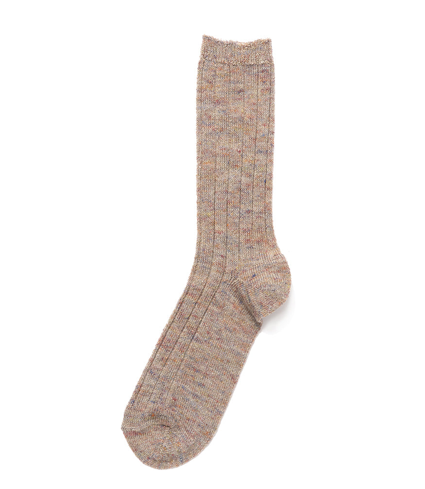A mid-calf knit sock featuring a mix of textured panels, ribbed leg section, and bold horizontal stripes around the arch and cuff.
