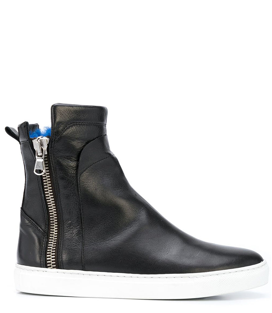 Ankle-high leather sneaker with side zipper closure, cushioned sole, and smooth panel construction. Features a rounded toe, pull tab at the heel, and soft interior lining.