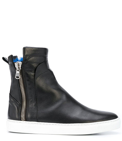 Ankle-high leather sneaker with side zipper closure, cushioned sole, and smooth panel construction. Features a rounded toe, pull tab at the heel, and soft interior lining.