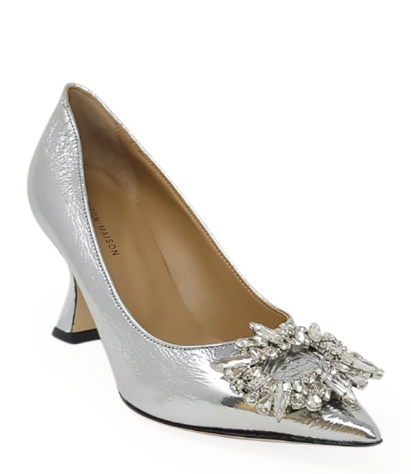 Pointed-toe pump crafted from premium leather with a softly crinkled finish, featuring an embellished jeweled buckle at the toe and a sculpted flared kitten heel. Designed with a leather-lined interior and a leather outsole for comfort and durability. Ele