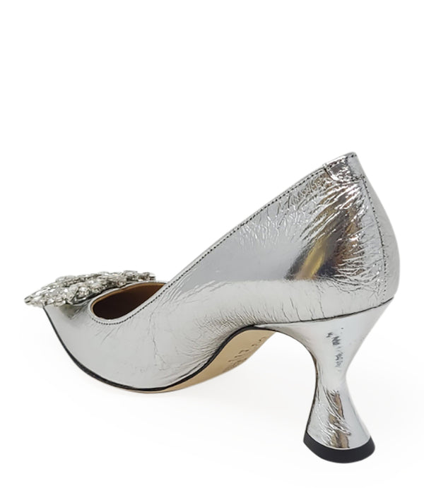 Pointed-toe pump crafted from premium leather with a softly crinkled finish, featuring an embellished jeweled buckle at the toe and a sculpted flared kitten heel. Designed with a leather-lined interior and a leather outsole for comfort and durability. Ele