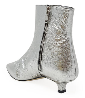 Pointed-toe ankle boot crafted from crinkled metallic leather, featuring a sleek side profile and a low kitten heel. Designed with a side zip closure for easy wear, a leather-lined interior for comfort, and a durable leather outsole. Contemporary and stre
