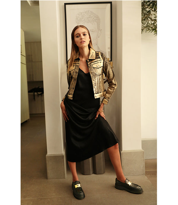 A leather loafer with an exaggerated lug sole and low-cut silhouette, featuring a wide strap with a geometric metal detail across the upper. Designed by Madison in Beverly Hills and handcrafted in Italy.