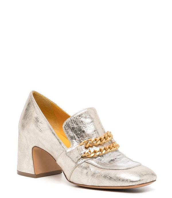 A leather heeled loafer with a block heel and rounded toe, featuring layered chain accents across the upper and a contrasting panel on the vamp. Designed by Madison in Beverly Hills and handcrafted in Italy.