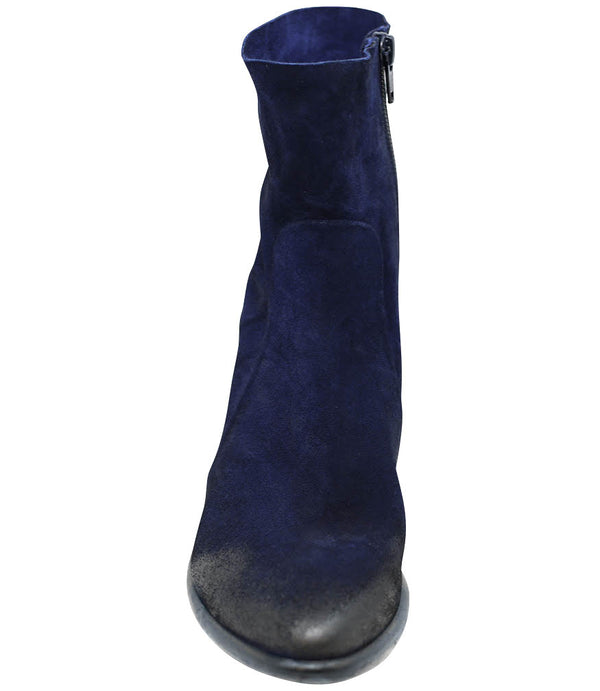 Ankle-height leather boot with a soft sheen finish, block heel, and side zipper closure. Designed with a rounded toe and minimal seam detailing.