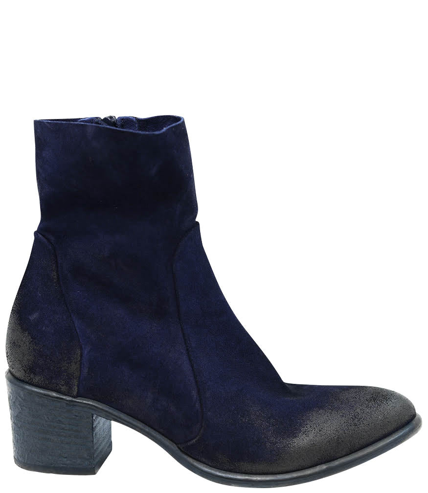 Ankle-height leather boot with a soft sheen finish, block heel, and side zipper closure. Designed with a rounded toe and minimal seam detailing.